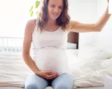 Gravid kvinna med smärta i magen, kanske Braxton Hicks sammandragningar.